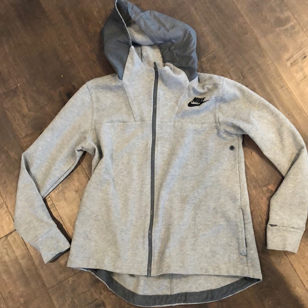 Nike like new zip up, high in the back lower front